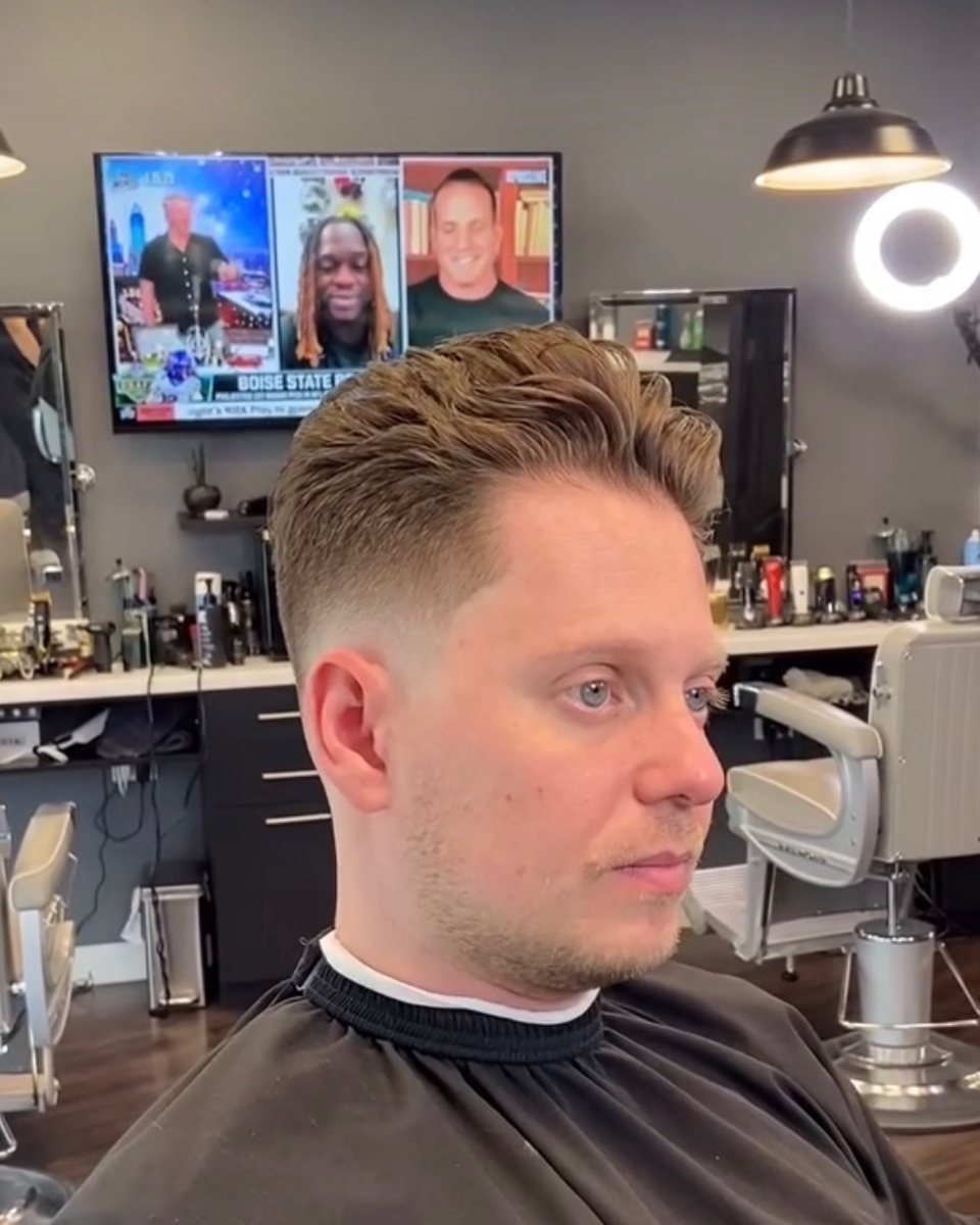 Voluminous brushed-back top with a tapered fade